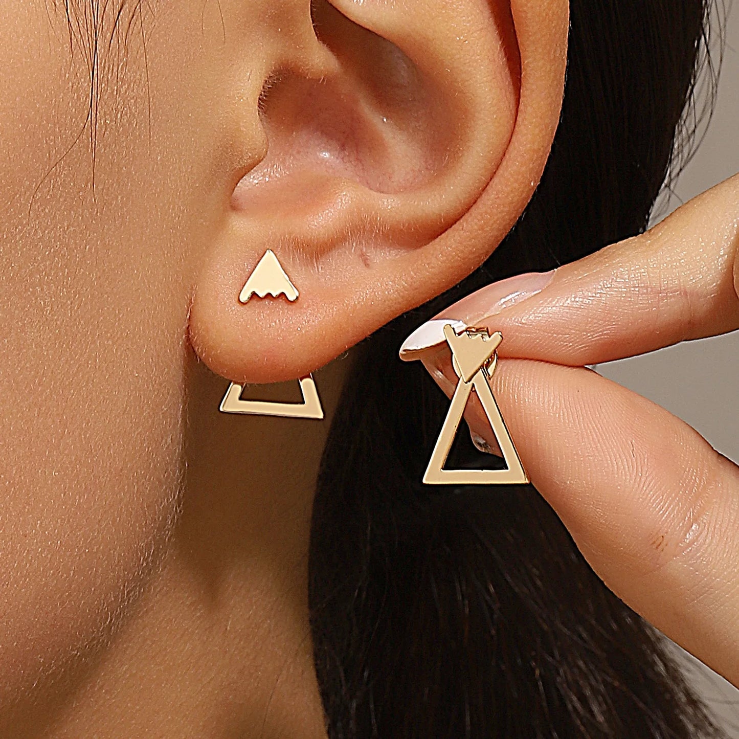 Triangle stud earrings for women.