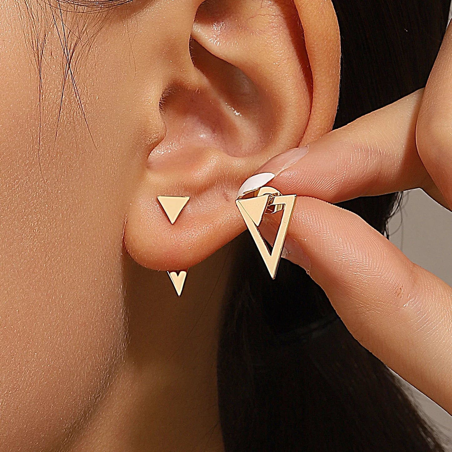 Triangle stud earrings for women.