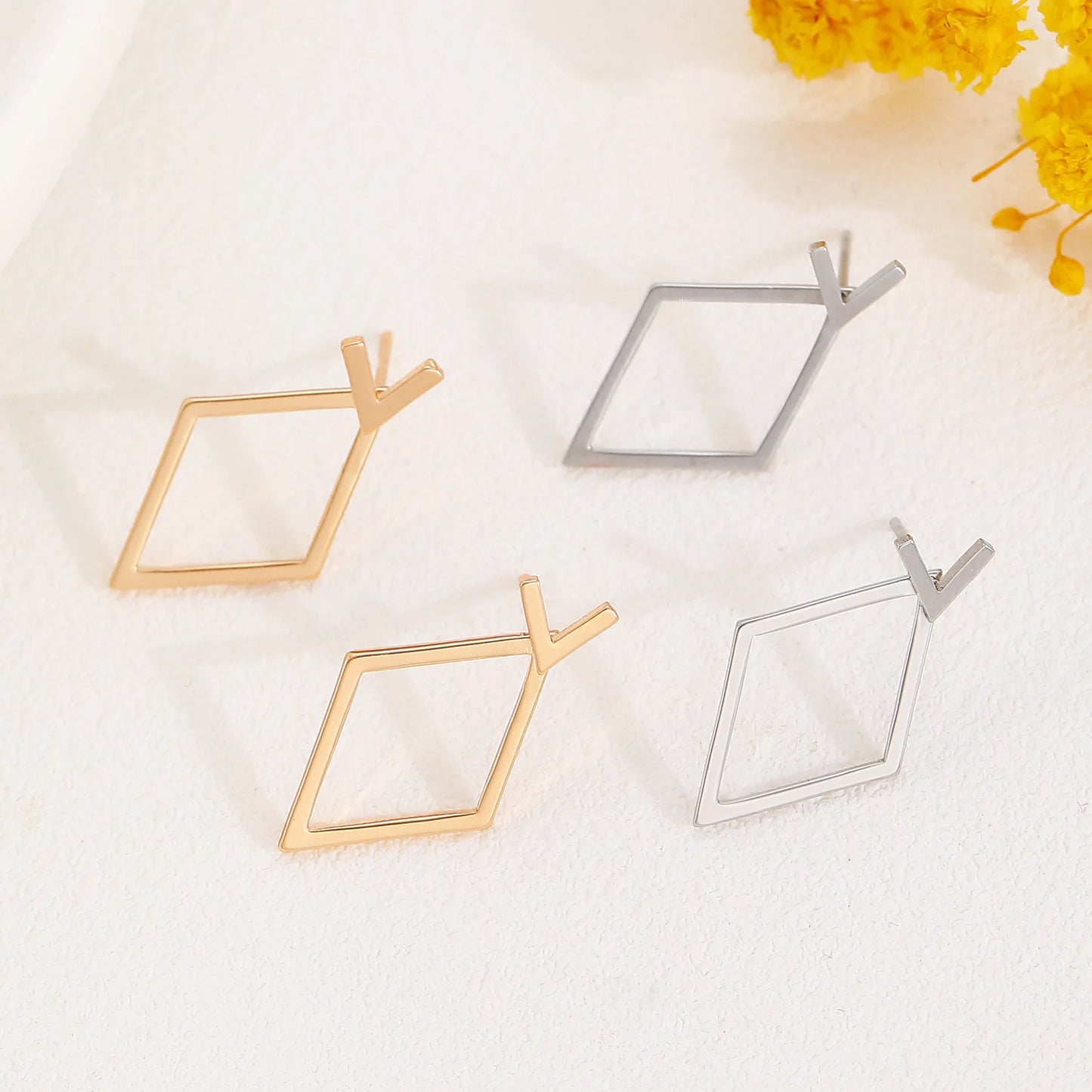Triangle stud earrings for women.